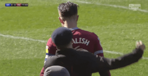 Watch Jack Grealish get Punched by a Pitch Invader