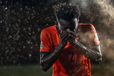 Professional football player out injured after sneezing